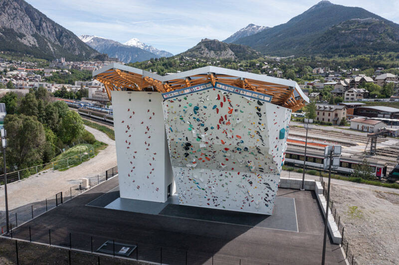 Construction of a climbing tower in Briançon, France, using timber framework and STFE roofing.