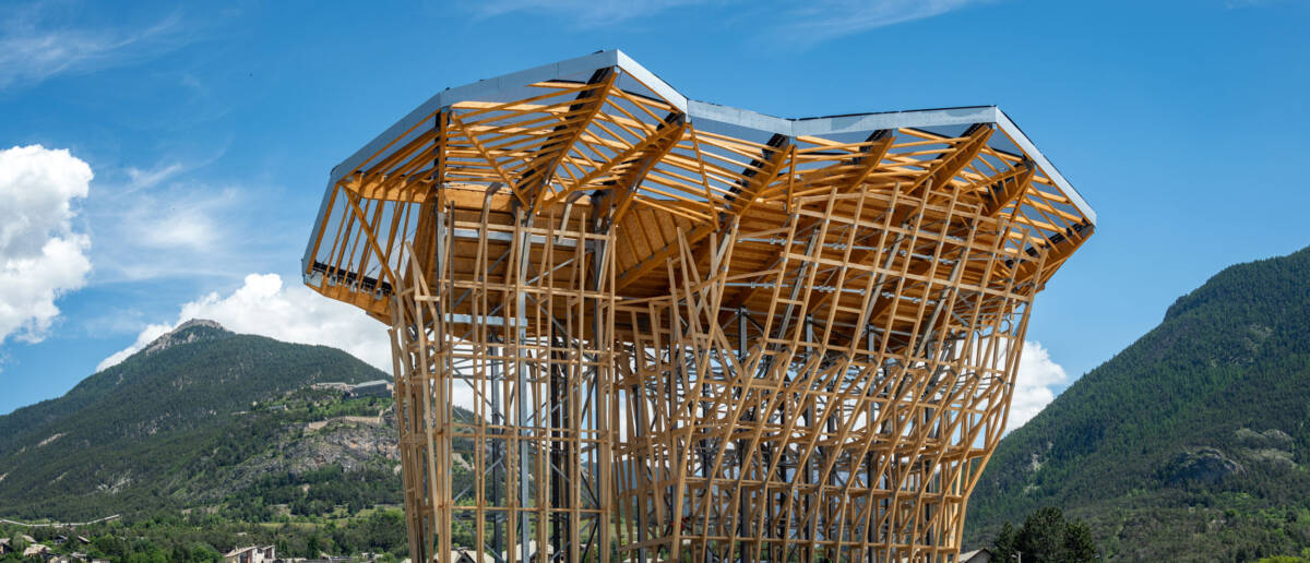 Construction of a climbing tower in Briançon, France, using timber framework and STFE roofing.