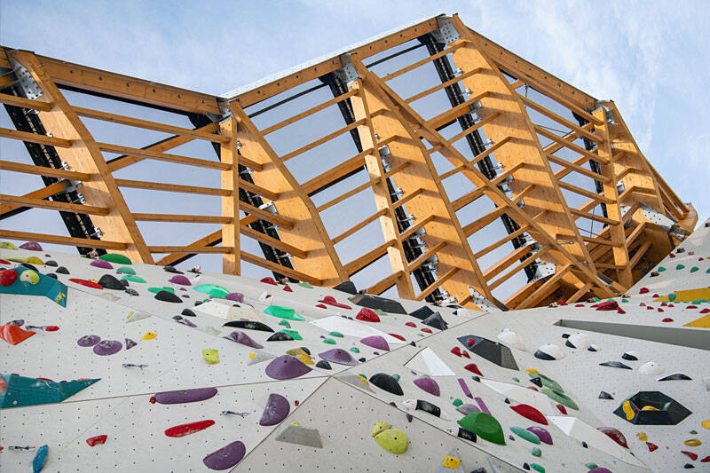 Construction of a climbing tower in Briançon, France, using timber framework and STFE roofing.
