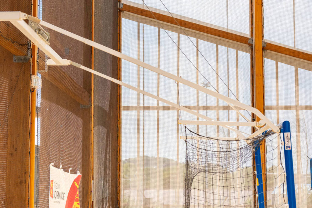 Discover the Houlgate sports canopy, featuring a hybrid structure, textile membrane, and motorized equipment for beach sports.