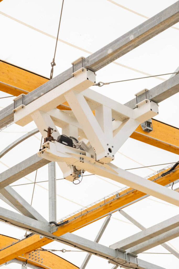 Discover the Houlgate sports canopy, featuring a hybrid structure, textile membrane, and motorized equipment for beach sports.