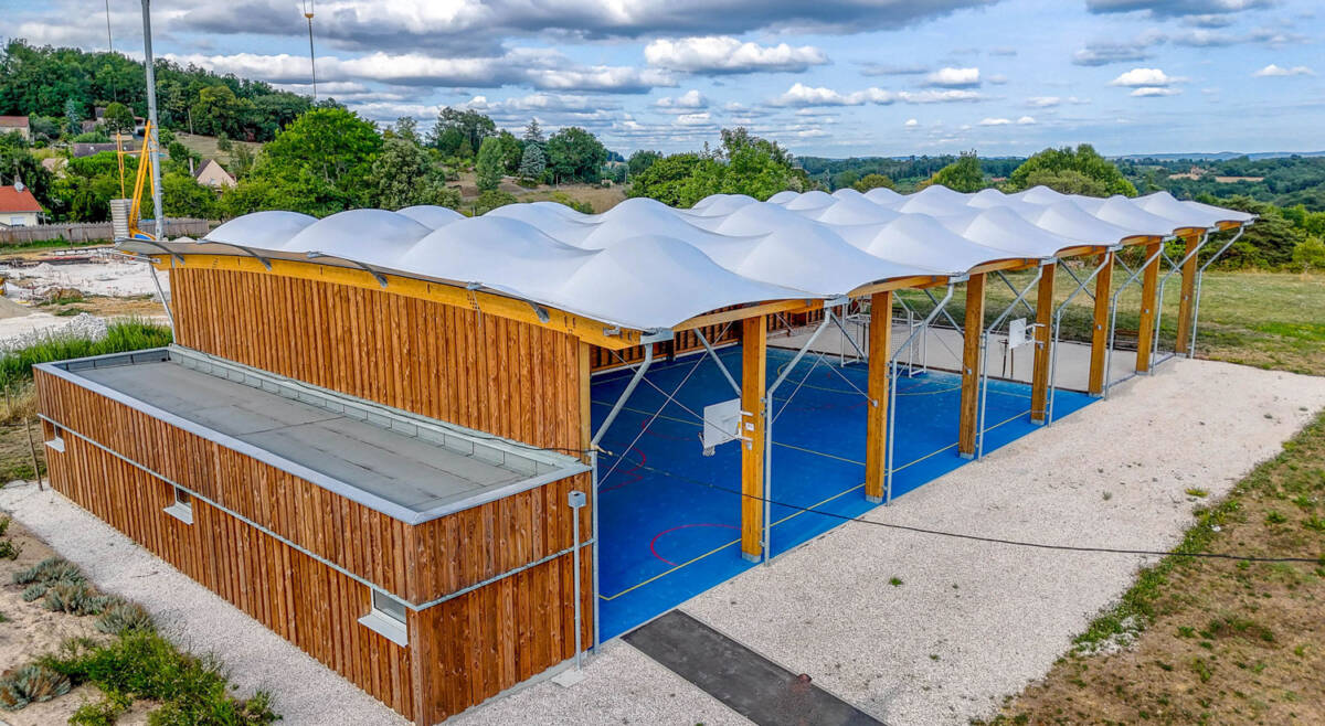 Construction of a multisport préau in Sarlat-la-Canéda, France.