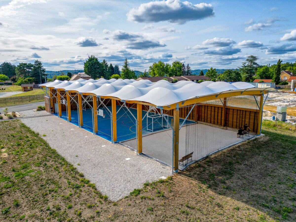 Construction of a multisport préau in Sarlat-la-Canéda, France.