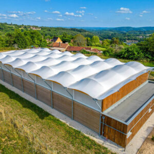 Construction of a multisport préau in Sarlat-la-Canéda, France.