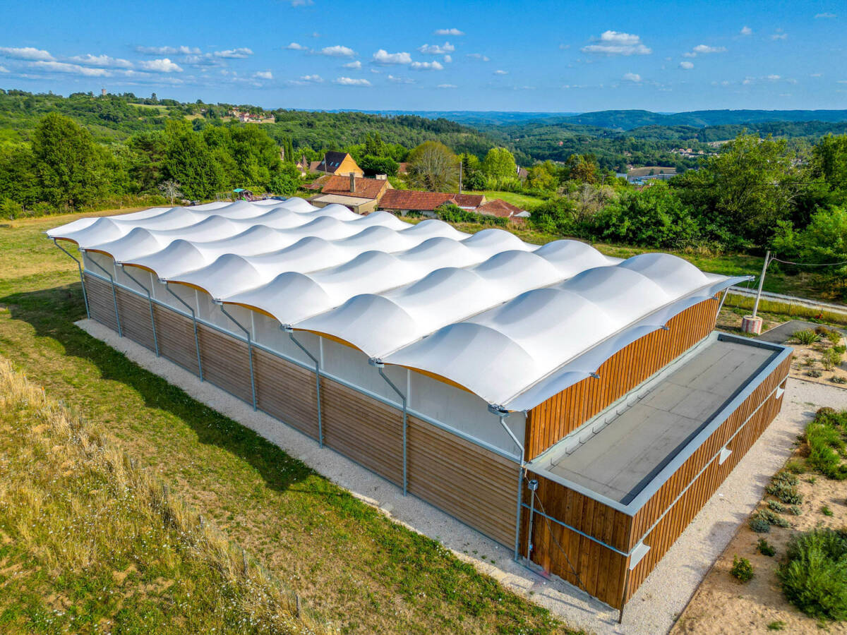 Construction of a multisport préau in Sarlat-la-Canéda, France.
