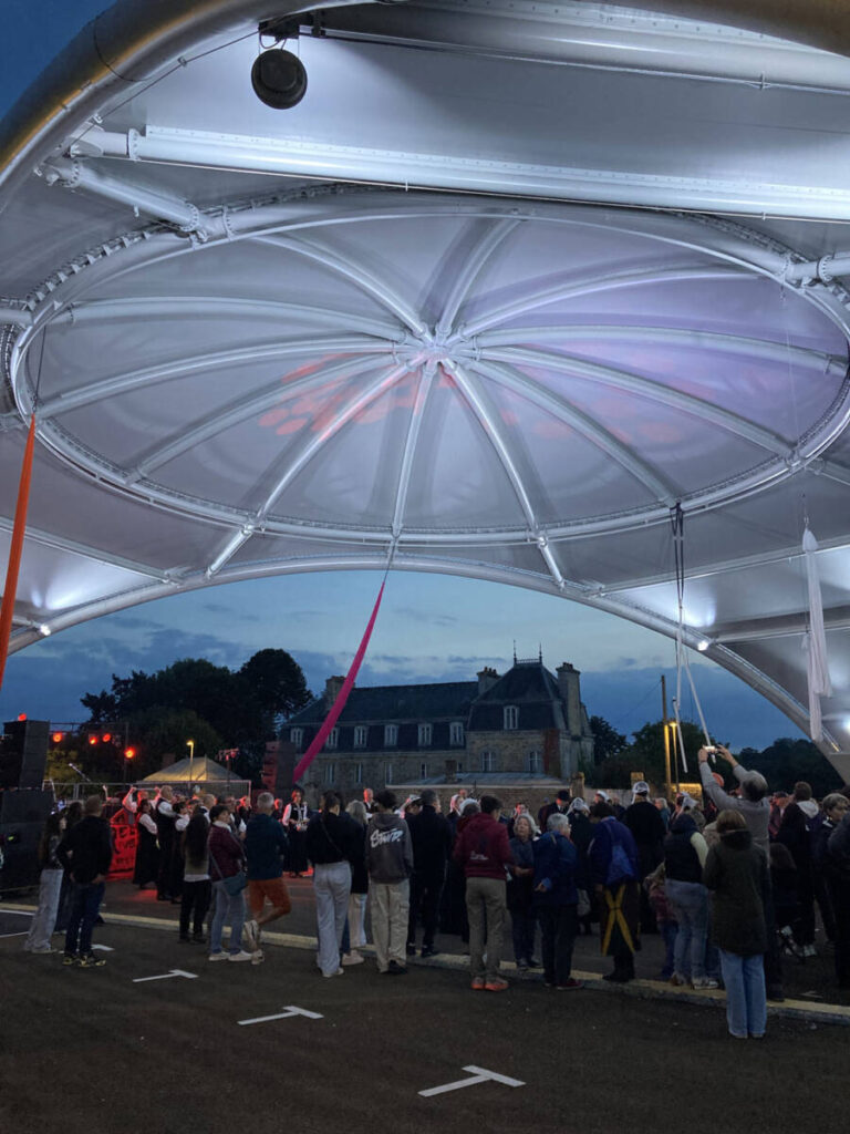 The VallyVellum in Guingamp: a monumental steel-and-fabric canopy spanning 13,940 sq ft, serving as an iconic centerpiece for Place du Vally.