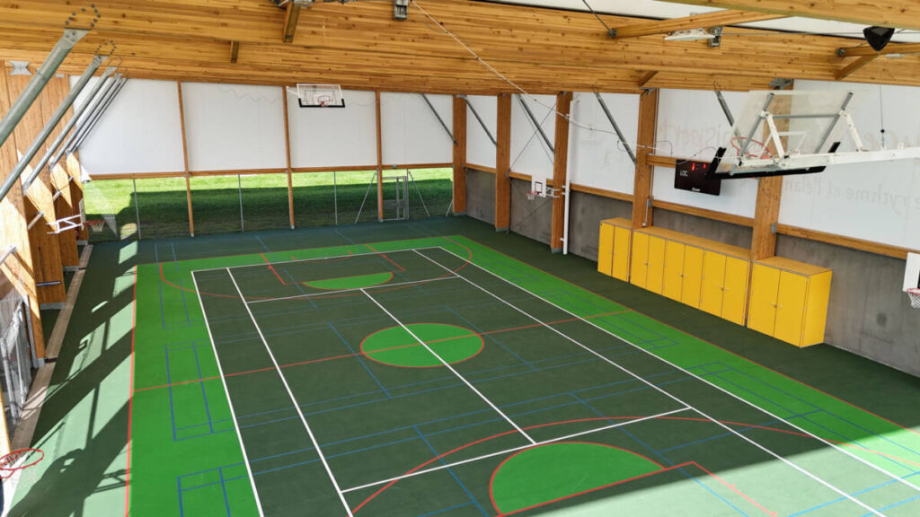Construction of a complex in Lucenay (France): sports hall with textile membrane and wooden frame, with annexes.