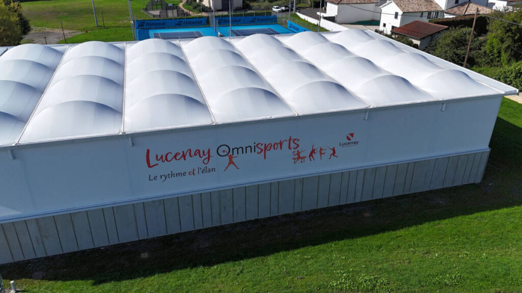 Construction of a complex in Lucenay (France): sports hall with textile membrane and wooden frame, with annexes.