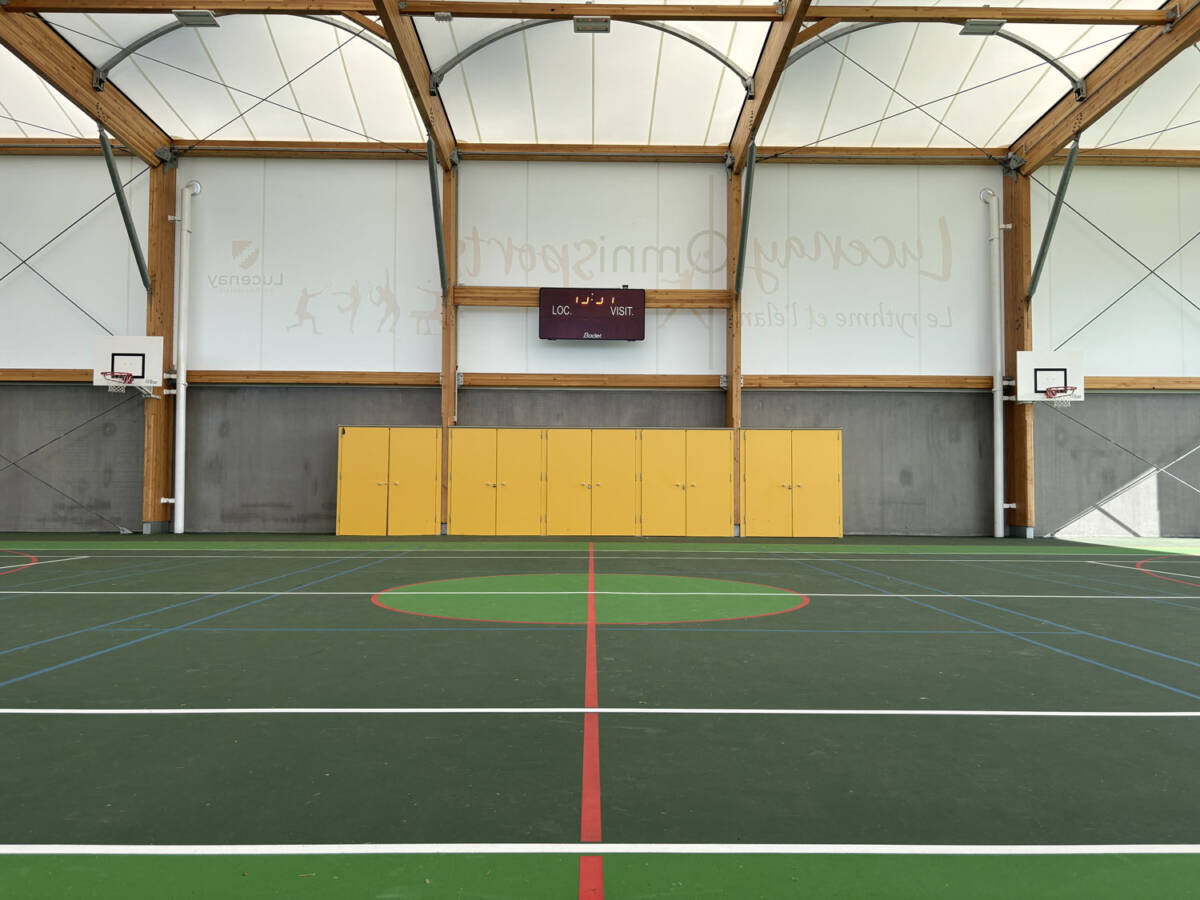 Construction of a complex in Lucenay (France): sports hall with textile membrane and wooden frame, with annexes.