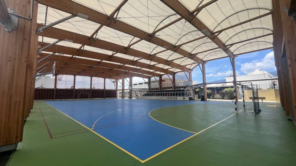 Sports hall in Joinville (FR): glued laminated timber structure and textile membrane, designed to withstand the tropical climate of Réunion.