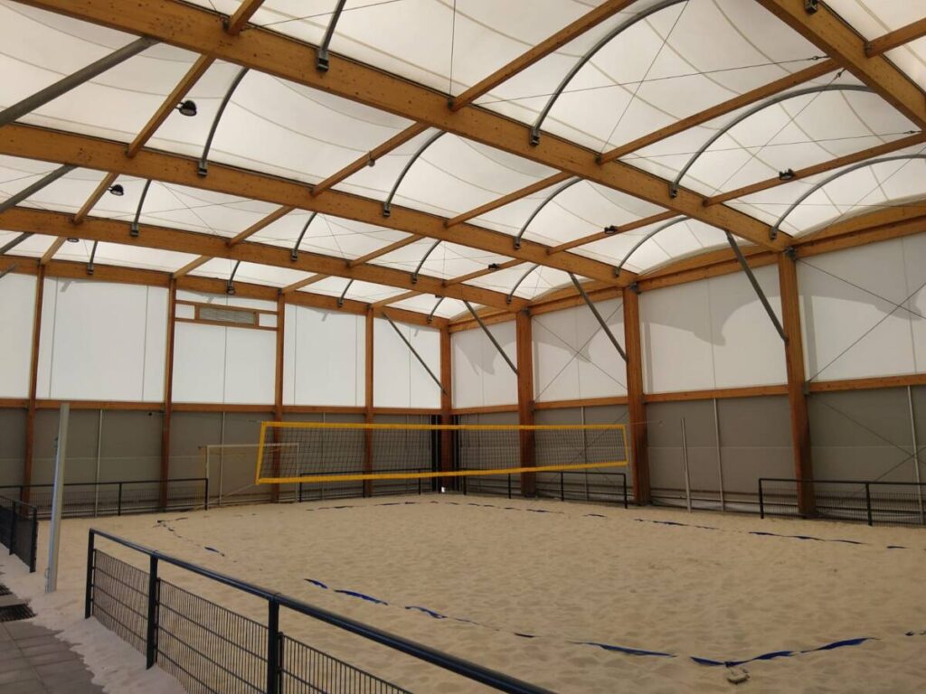 Tensile fabric and wood frame for this sports canopy in Germany