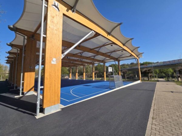Hybrid timber and galvanised steel frame with translucent tensile membrane roof