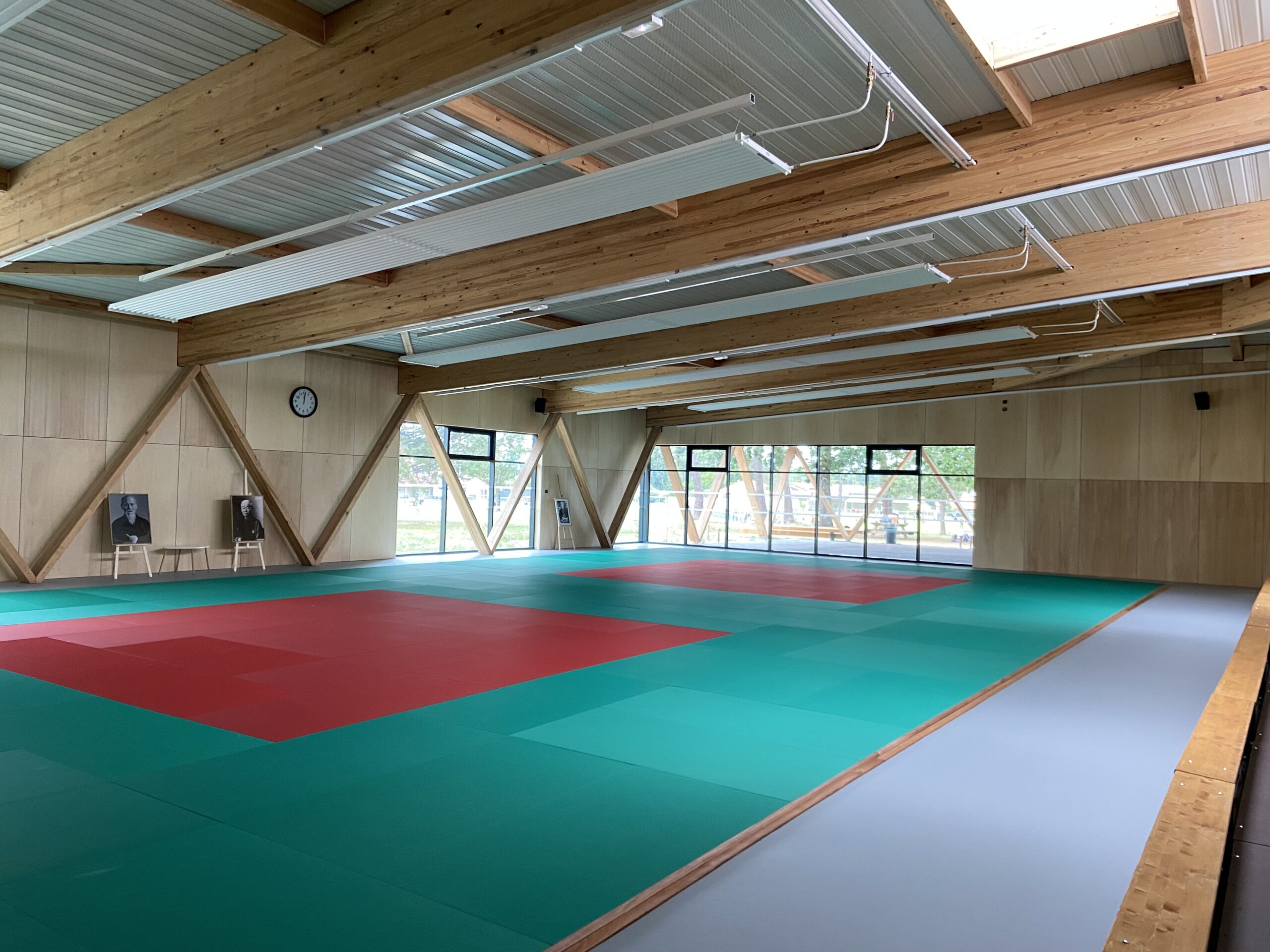 Gymnasium lit by daylight through the translucent tensile membrane roof